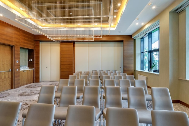 MINSK BELARUS JULY 2017 rows of seats in interior of modern empty conference hall for business meetings