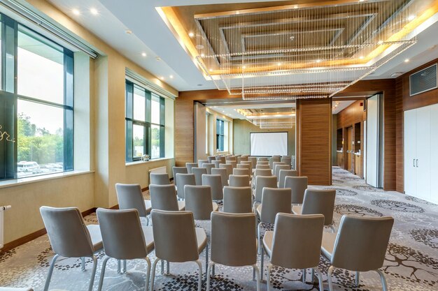 MINSK BELARUS JULY 2017 rows of seats in interior of modern empty conference hall for business meetings