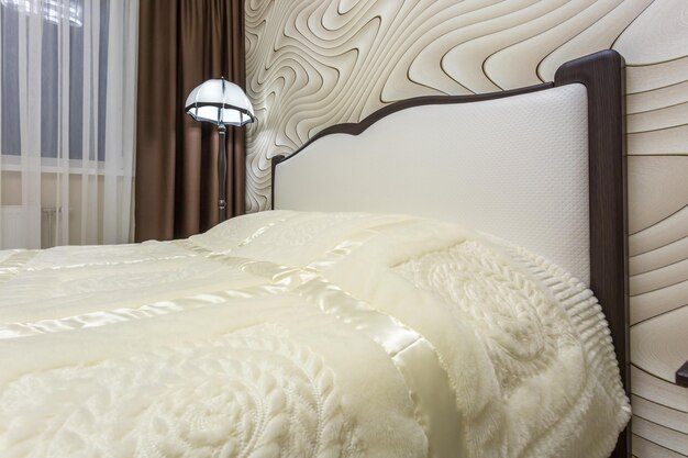 Minsk belarus june 2020 double bed with pillows in interior of\
the modern intimate bedroom in loft flat in light color style\
apartments