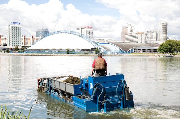 Minsk Belarus June 30 2022 machine for cleaning water bodies from algae on the lake