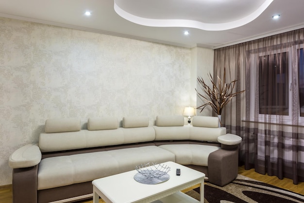 MINSK BELARUS MAY 2020 Interior of the modern guestroom in studio apartments with sofa and tv