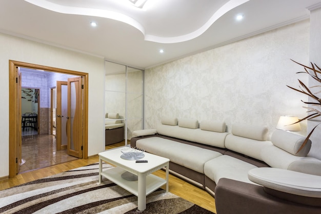 MINSK BELARUS MAY 2020 Interior of the modern guestroom in studio apartments with sofa and tv