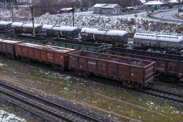 Minsk belarus november 2020 long railway freight trains with\
lots of wagons stands on parking in winter day