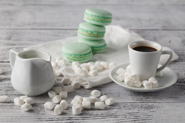 Mint cookies macaroon with milk and coffee.