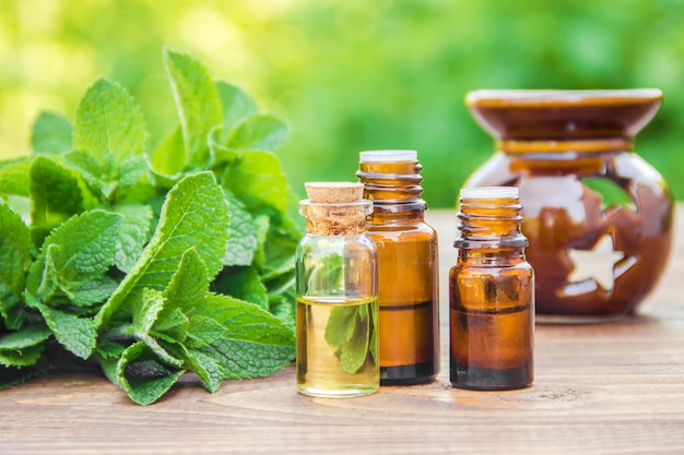 The mint extract in a small jar. Selective focus.