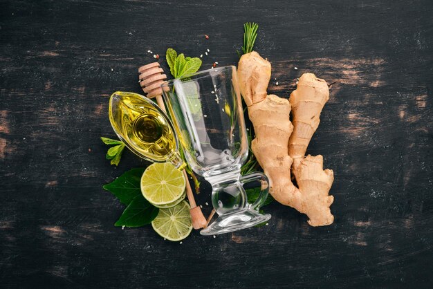 Mint lime ginger and lemon On a wooden background Top view Copy space