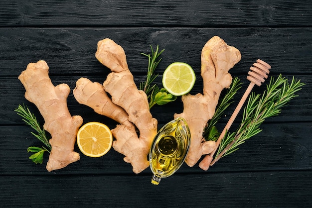 Mint lime ginger and lemon On a wooden background Top view Copy space