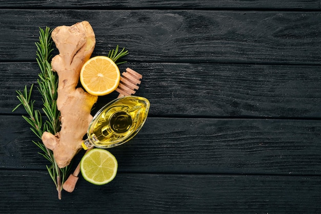 Mint lime ginger and lemon On a wooden background Top view Copy space