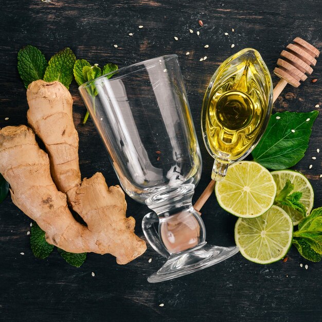 Mint lime ginger and lemon On a wooden background Top view Copy space