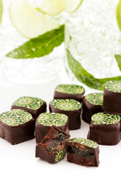 Mint mojito truffles on a white background.