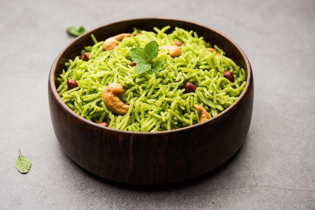 Mint Rice - Basmati rice cooked with fresh pudina leaves and garnished with Peanuts and Cashew nuts or kaju