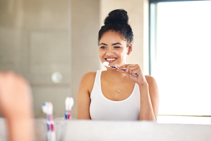 Photo mirror dental care and woman with toothbrush in bathroom for morning hygiene teeth routine smile wellness and female person with oral health product for plaque gums and fresh breath at home