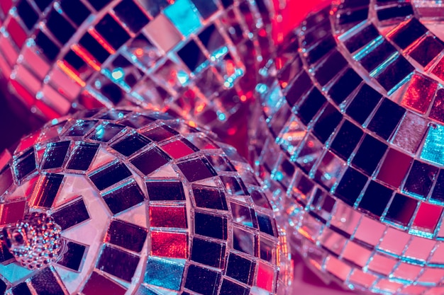 Mirror disco balls over pink background. Party, nightlife concept