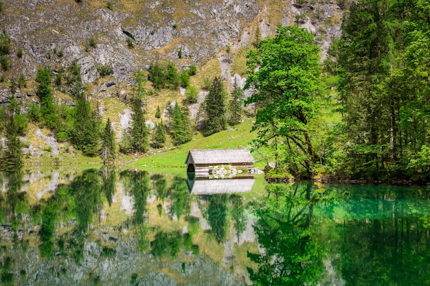 Mirror image of Alps in the Obersee lake Germany