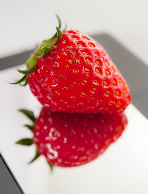 Mirror and strawberry. Heart shape. 