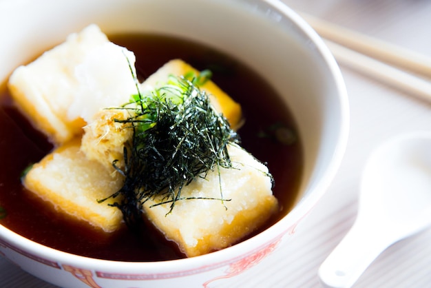 Miso soup is a Japanese soup made from a dashi broth and miso paste, which gives it its name.