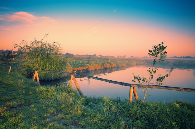 Misty morning. mist over lake in village