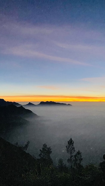 Misty morning mountain top view in Kerala