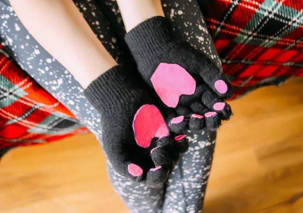 Mittens decorated with hearts on child's hands