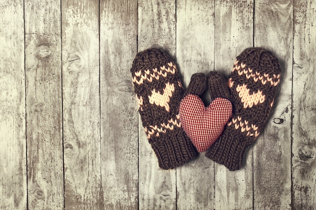 Mittens with hearts and a plush heart