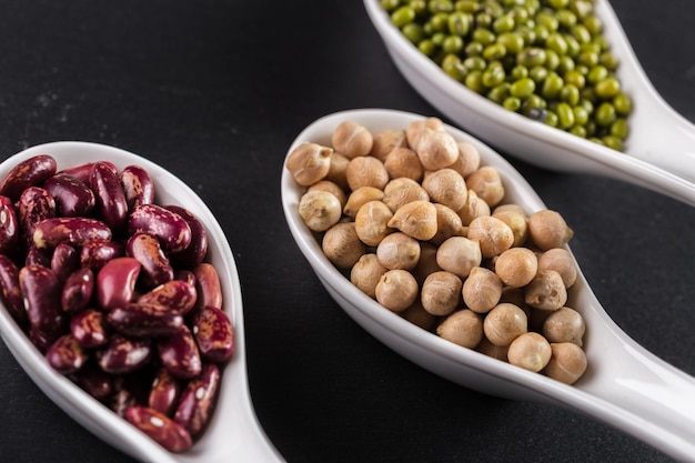 Mix of beans on wooden table