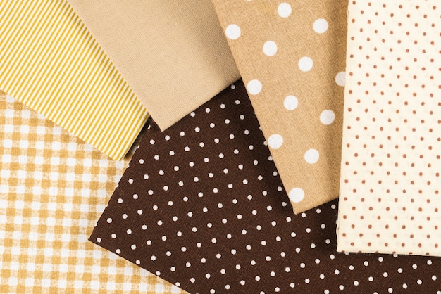 Mix of beige, white and brown cotton fabric.