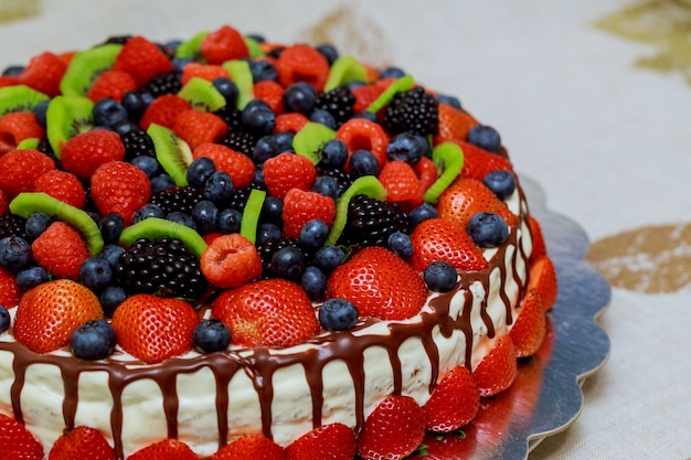 Mix berries cake with beautiful berries strawberries, raspberries, blueberries