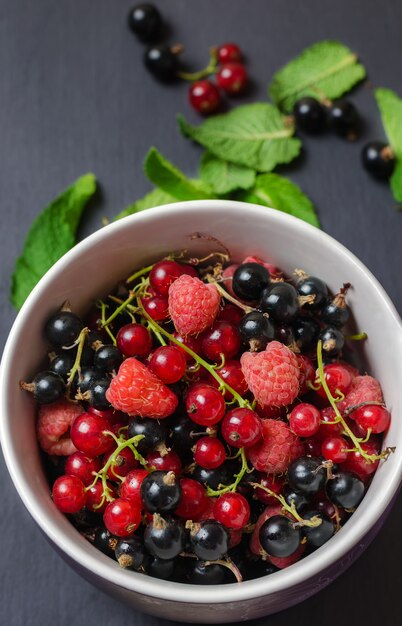 Mix of berries on dark surface.