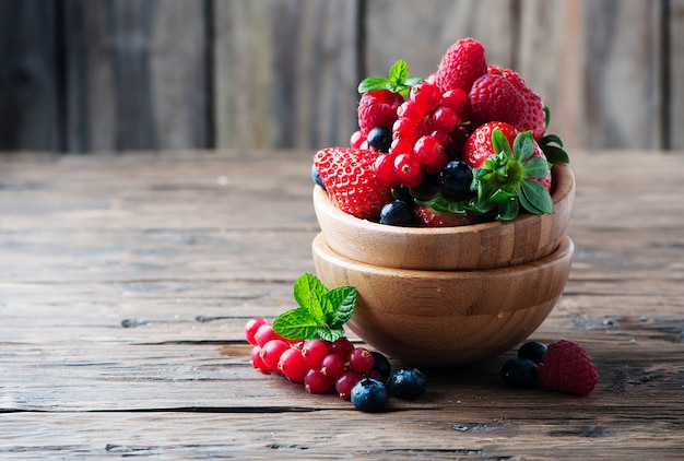 Mix of berries on the wooden table