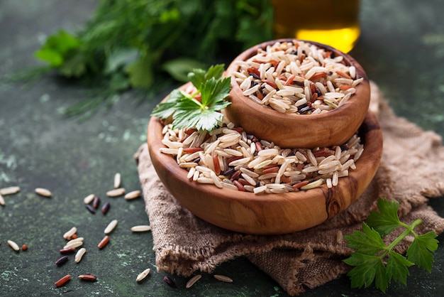 Mix of brown, red and wild rice in bowl