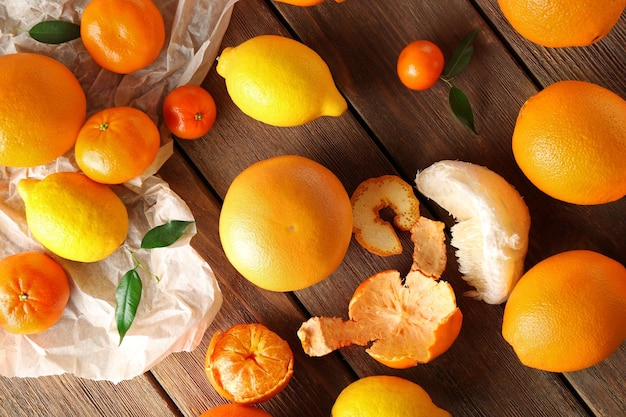 Mix of citrus fruits on wooden table