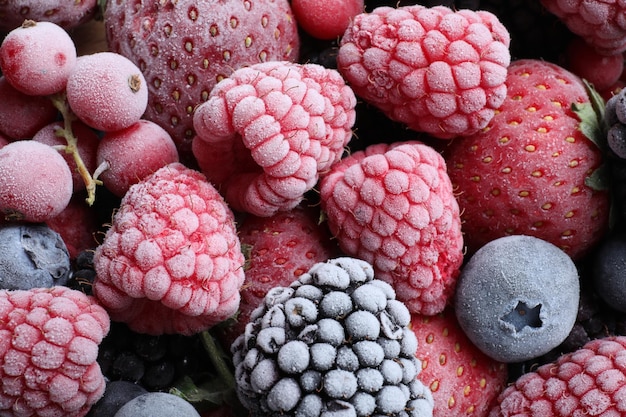 Mix of different frozen berries as background top view