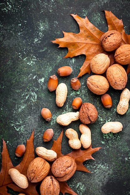 Photo mix of different nuts. walnuts, peanuts and hazelnuts