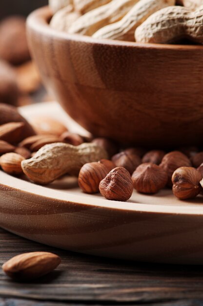 Mix of different nuts on the wooden table