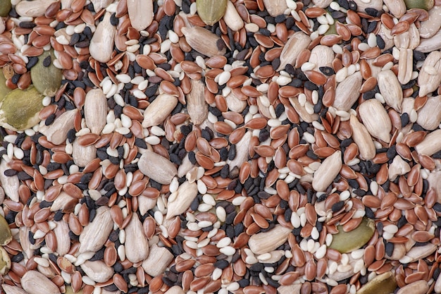 Mix of different seeds background top view healthy eating