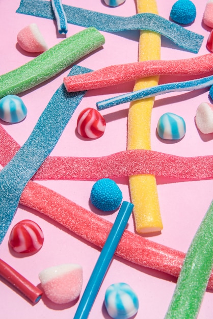 Mix of different types of colorful candies jellies