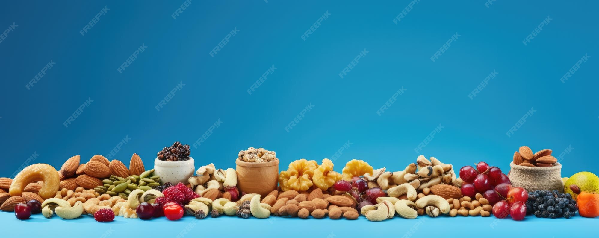 Premium Photo Mix of different types of nuts and dried fruit healthy