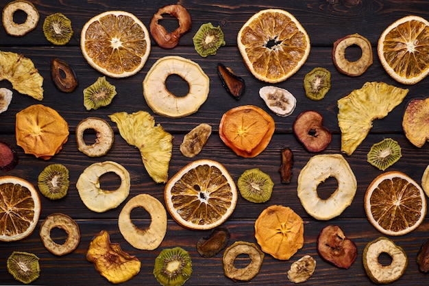 Mix of dried fruits on a wooden table