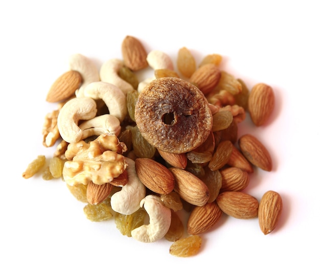 mix of dry nuts and fruits closeup on white background