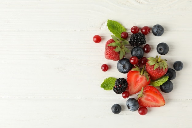 Mix of fresh berries on wooden