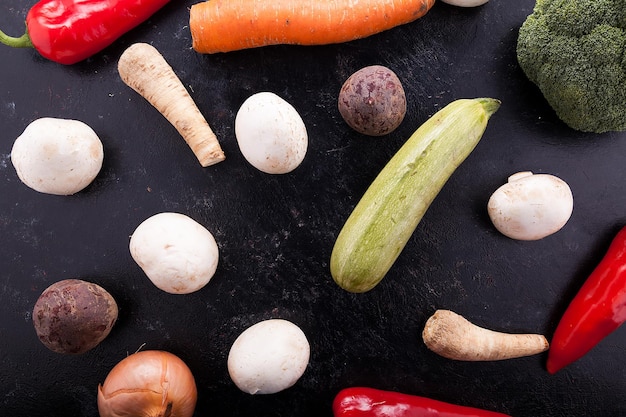 Mix of fresh vegetables on a wooden dark table