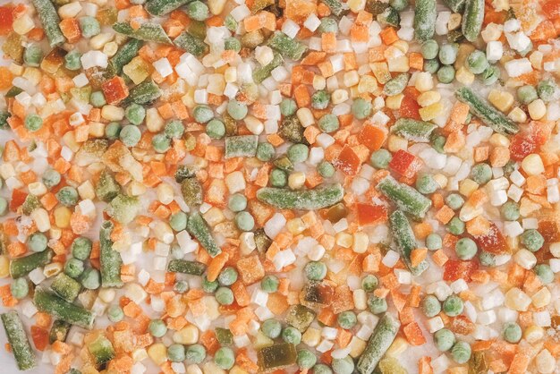 Mix of frozen vegetables as a background texture. Top view. Copy, empty space for text