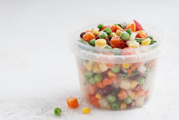 Mix of frozen vegetables in a container