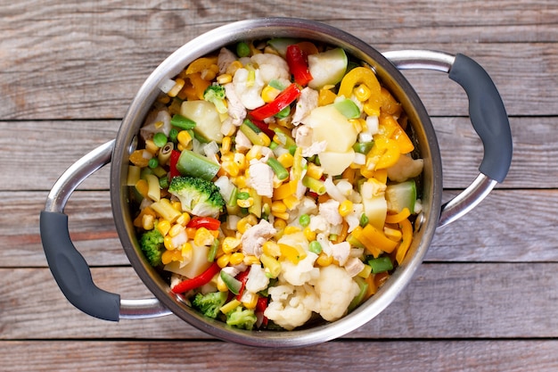 Mix of frozen vegetables in the pan. Top view