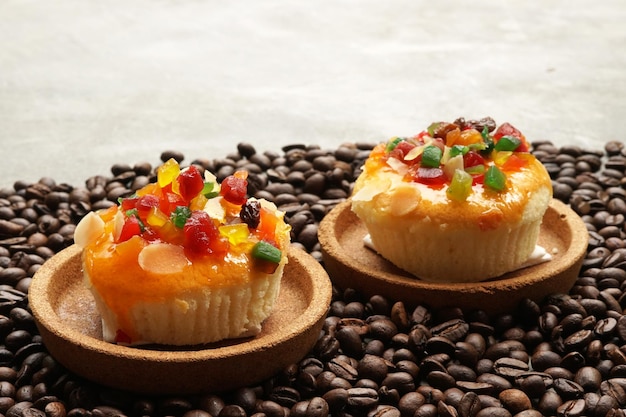 Mix fruit cupcake on coffee beans background