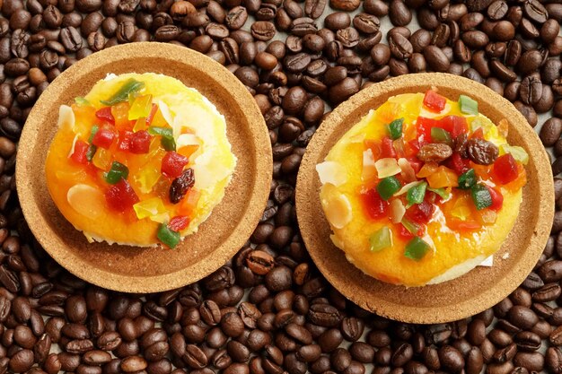 Mix fruit cupcake on coffee beans background