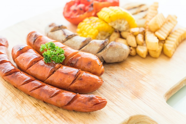 mix grilled sausage with vegetables and french fries