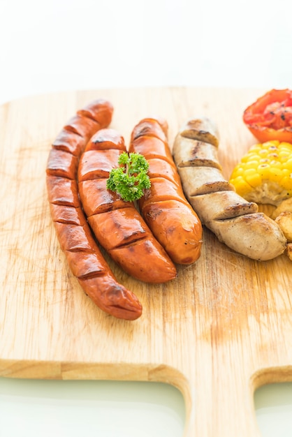 mix grilled sausage with vegetables and french fries