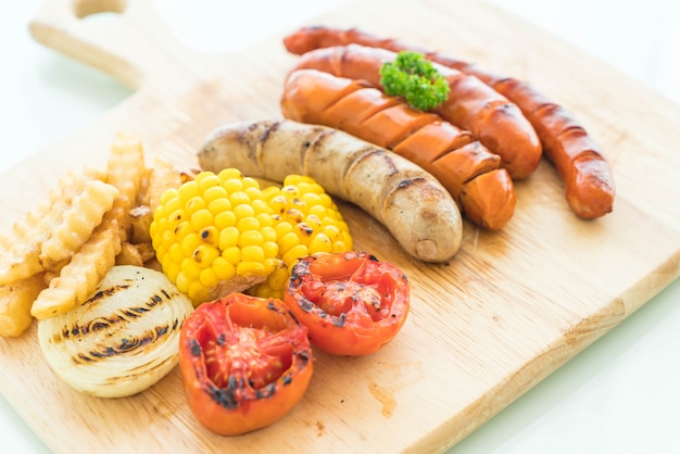 mix grilled sausage with vegetables and french fries