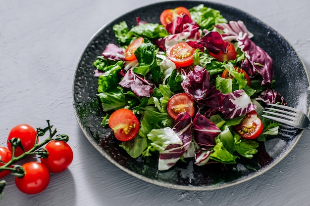 Mix healthy salad romaine,chard,spinash with tomatoes